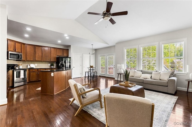 living area with ceiling fan, high vaulted ceiling, dark wood finished floors, recessed lighting, and baseboards