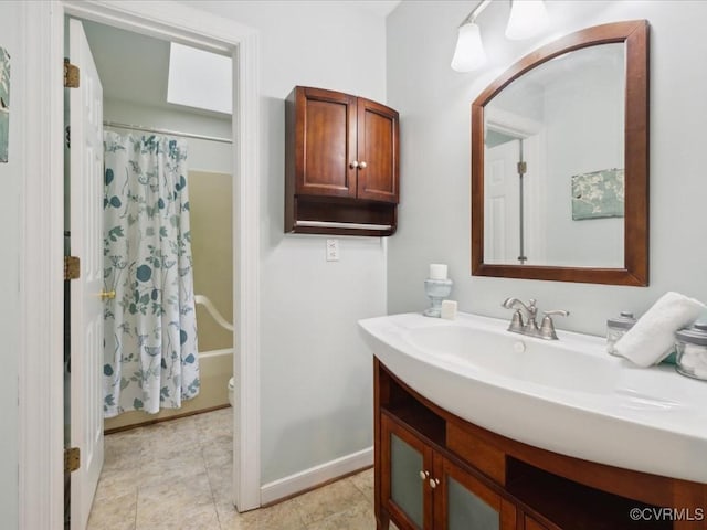 2004 Westwood Ct, Powhatan, VA 23139 - bathroom with vanity, toilet, shower / bath combination with curtain, and baseboards