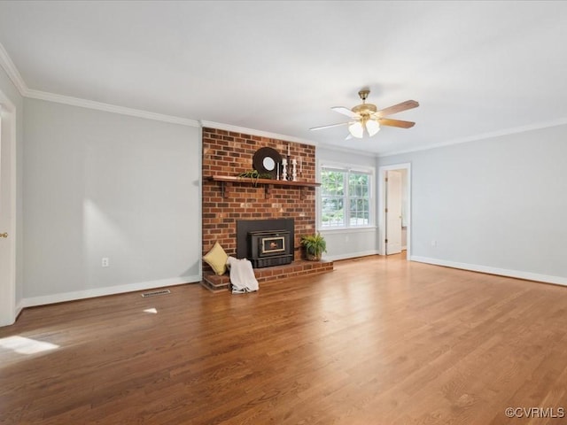 2004 Westwood Ct, Powhatan, VA 23139 - unfurnished living room featuring crown molding, baseboards, wood finished floors, a ceiling fan, and a brick fireplace
