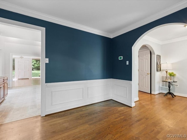 2004 Westwood Ct, Powhatan, VA 23139 - unfurnished room featuring wood finished floors, a wainscoted wall, ornamental molding, and arched walkways