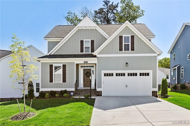 view of front of home featuring board and batten siding, a front yard, driveway, and roof with shingles