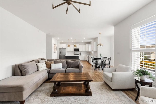 10001 Craftsbury Dr, Midlothian, VA 22312 - living area featuring light wood-type flooring, ceiling fan, and recessed lighting