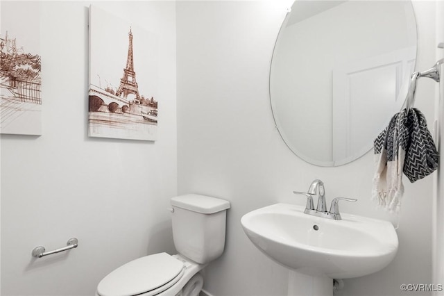 10001 Craftsbury Dr, Midlothian, VA 22312 - half bath with a sink, toilet, and baseboards
