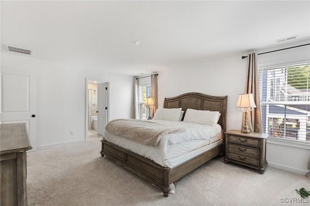 10001 Craftsbury Dr, Midlothian, VA 22312 - bedroom with light carpet, baseboards, and ensuite bath