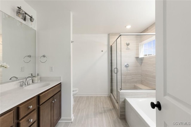 10001 Craftsbury Dr, Midlothian, VA 22312 - full bathroom with vanity, a stall shower, toilet, a bath, and baseboards