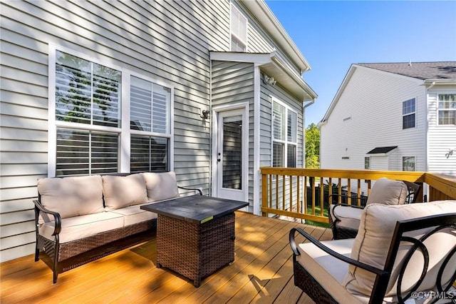 wooden terrace featuring an outdoor living space