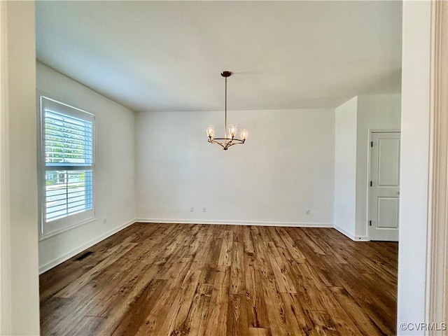 10001 Craftsbury Dr, Midlothian, VA 22312 - unfurnished room with dark wood-type flooring, a chandelier, and baseboards