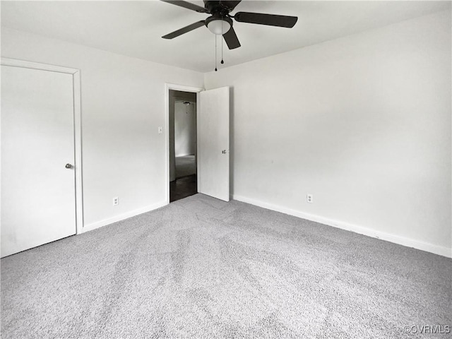 unfurnished bedroom with carpet flooring, ceiling fan, and baseboards