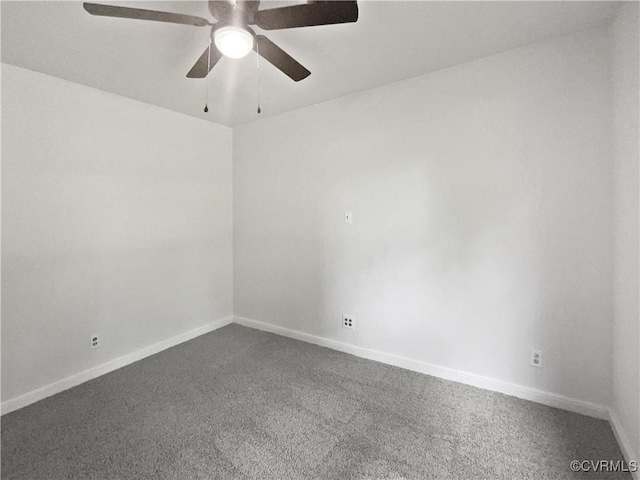 empty room with baseboards, a ceiling fan, and dark carpet