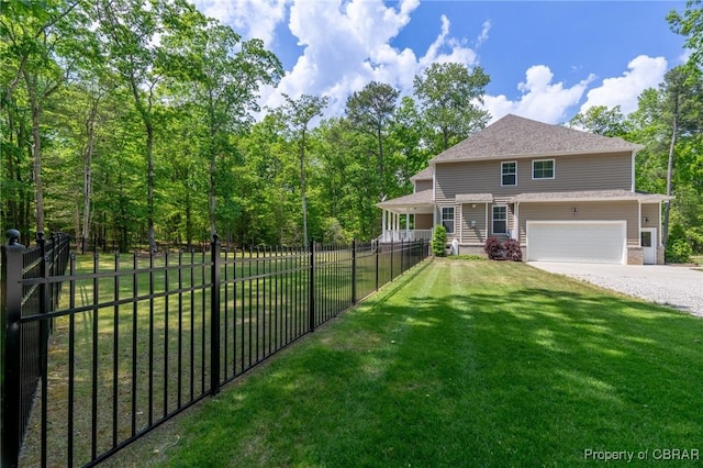 11264 Rivers Edge Ter, Gloucester, VA 23061 - view of front of house with fence, an attached garage, driveway, and a front yard