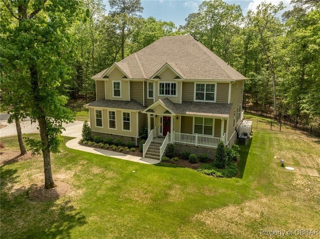 11264 Rivers Edge Ter, Gloucester, VA 23061 - view of front of home with a shingled roof, fence, covered porch, and a front yard