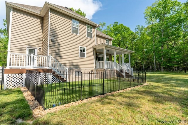 11264 Rivers Edge Ter, Gloucester, VA 23061 - back of property featuring stairs, a lawn, covered porch, and fence private yard