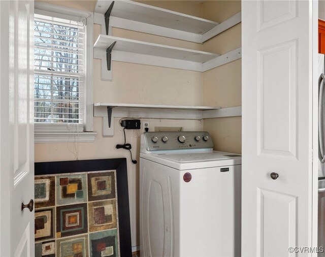 laundry area featuring washer / clothes dryer and laundry area