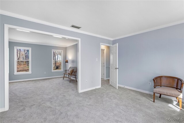 living area featuring baseboards, ornamental molding, carpet flooring, and visible vents
