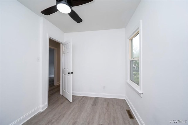512 Pollock St, Richmond, VA 23222 - unfurnished bedroom with ceiling fan, baseboards, visible vents, and wood finished floors