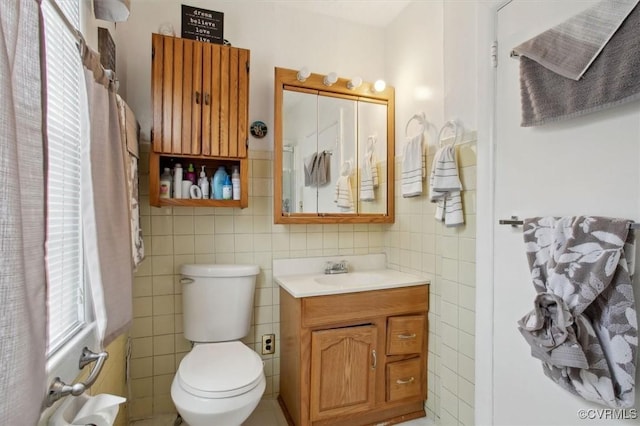 6266 Richmond Rd, Williamsburg, VA 23188 - bathroom with toilet, tile walls, and vanity