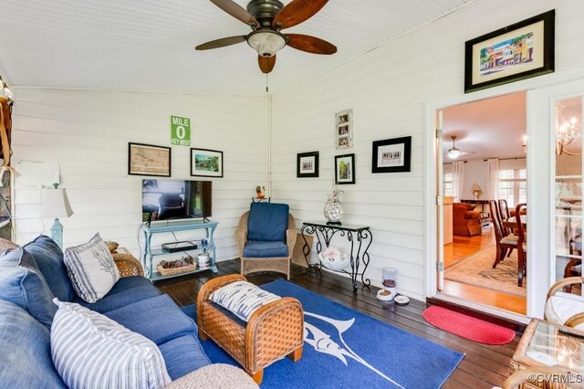 living area featuring wood-type flooring and ceiling fan