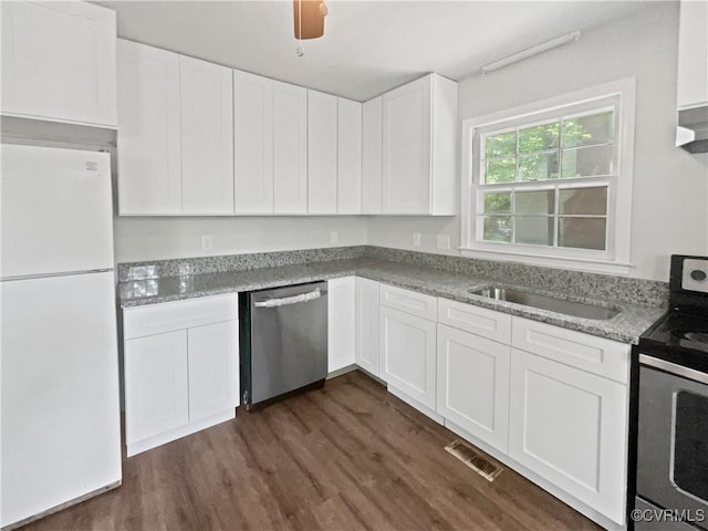 10901 Drayton Rd, Chester, VA 23831 - kitchen with visible vents, dark wood finished floors, a sink, white cabinets, and stainless steel appliances
