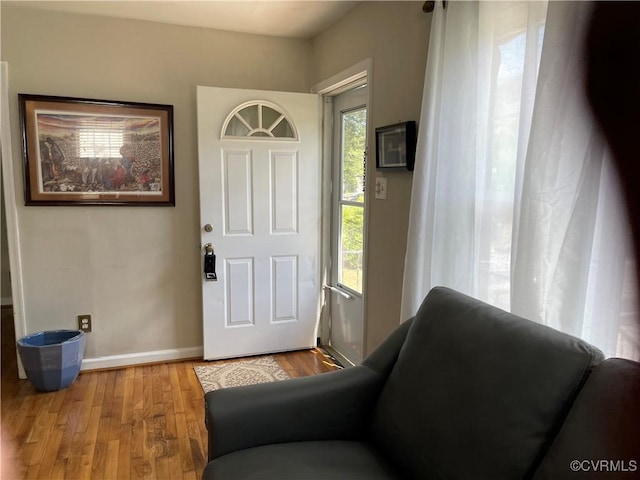 entrance foyer with wood finished floors and baseboards