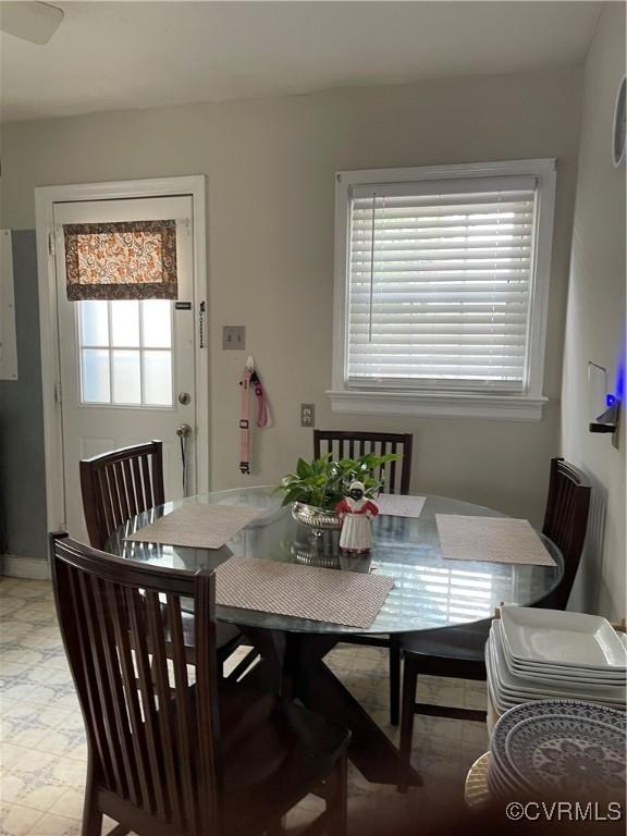 dining area featuring light floors