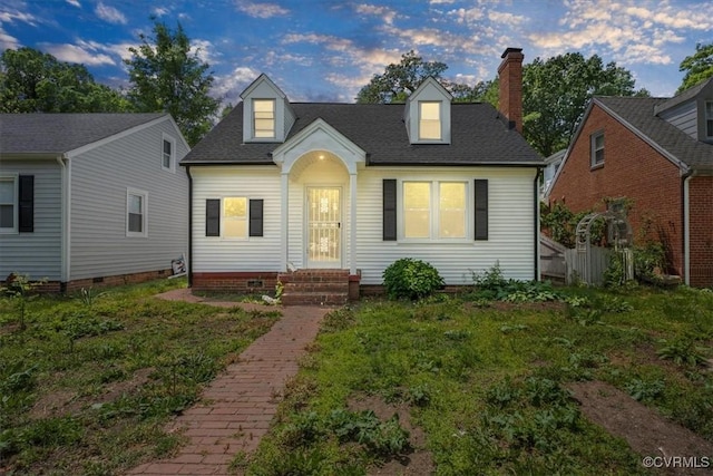 cape cod-style house featuring crawl space, a chimney, entry steps, and roof with shingles