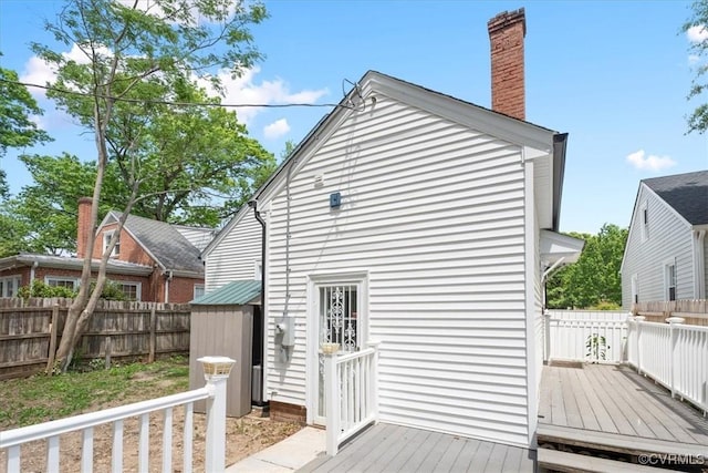 view of outbuilding with fence