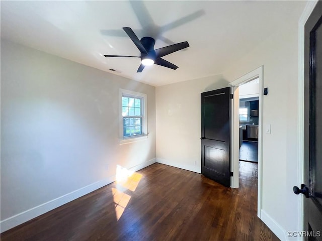 6503 W Grace St, Henrico, VA 23226 - unfurnished bedroom with dark wood-style flooring and ceiling fan