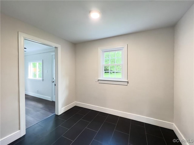 6503 W Grace St, Henrico, VA 23226 - unfurnished room with baseboards and dark tile patterned flooring