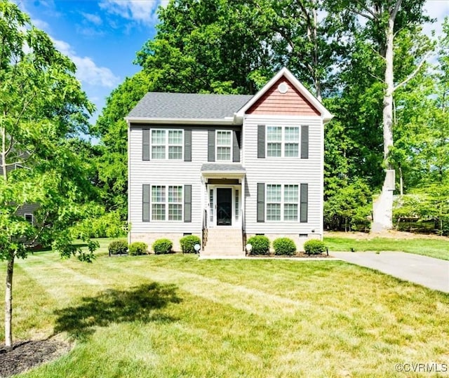 view of front of property with a front lawn and crawl space