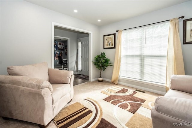living area with visible vents, carpet flooring, baseboards, and recessed lighting