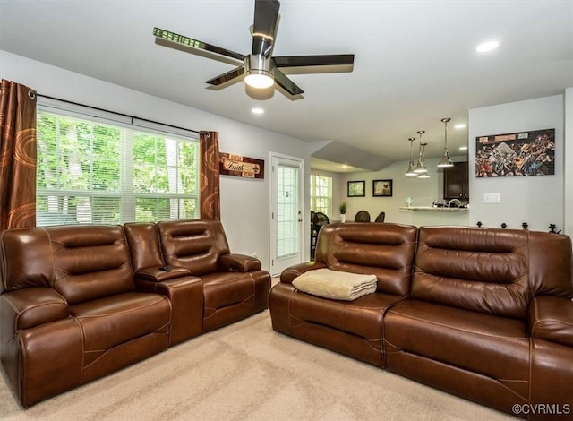 carpeted living area featuring recessed lighting, a ceiling fan, and a healthy amount of sunlight