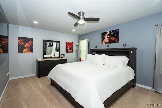 bedroom with baseboards, light carpet, and recessed lighting