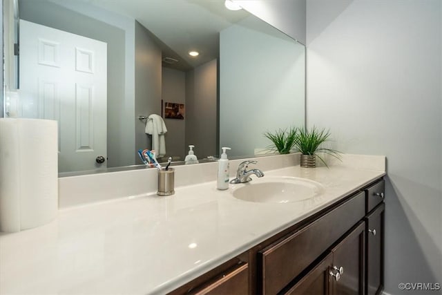 bathroom with vanity and recessed lighting