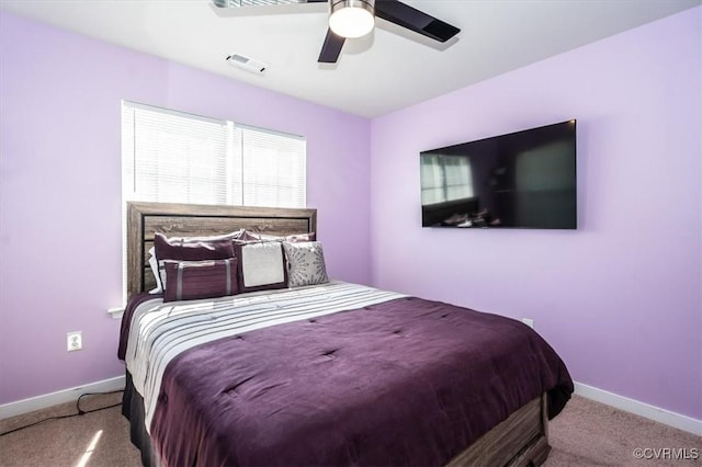 bedroom featuring baseboards, ceiling fan, carpet flooring, and visible vents