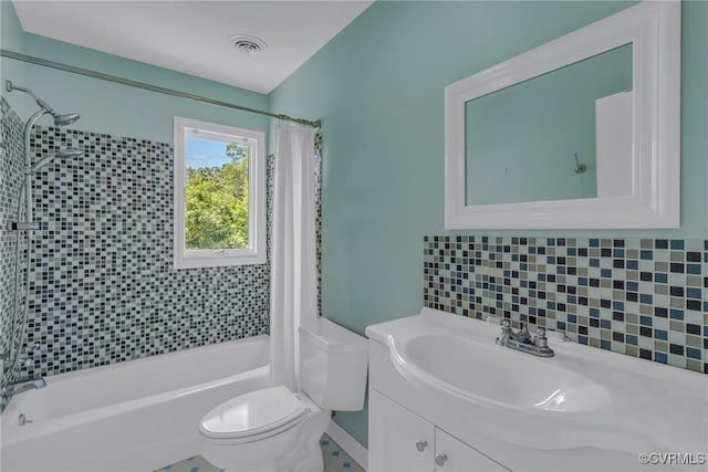 2215 Ditchley Rd, Kilmarnock, VA 22482 - full bath with shower / bath combination with curtain, toilet, backsplash, and vanity