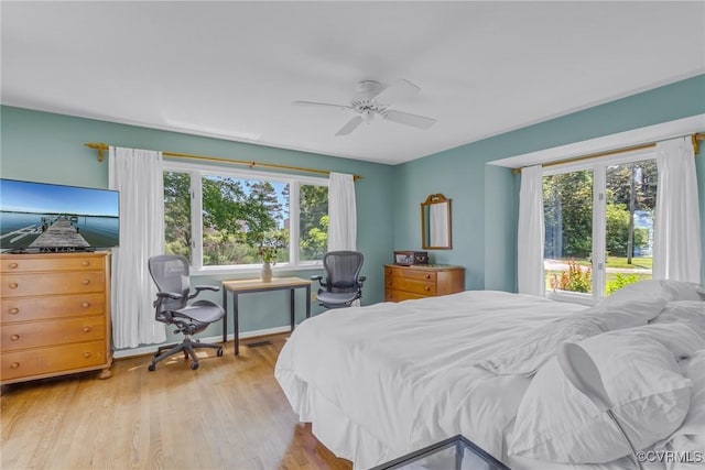 2215 Ditchley Rd, Kilmarnock, VA 22482 - bedroom with light wood finished floors and ceiling fan