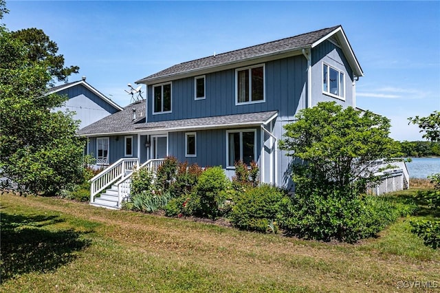 2215 Ditchley Rd, Kilmarnock, VA 22482 - view of front of home with a front yard and a shingled roof