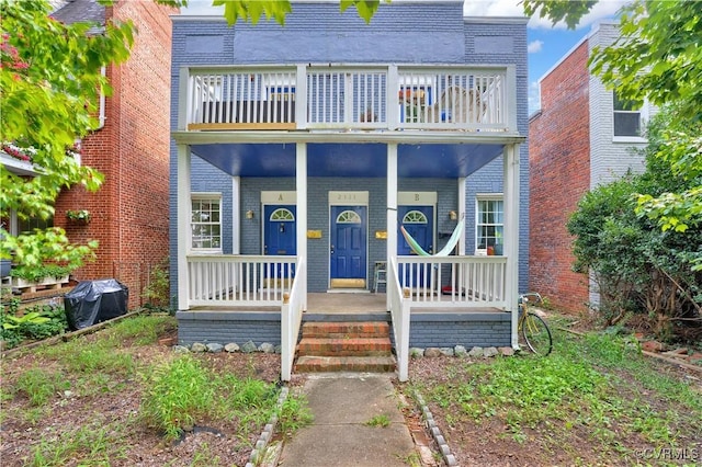 2111 Maplewood Ave, Richmond, VA 23220 - view of front of house featuring a porch, brick siding, and a balcony