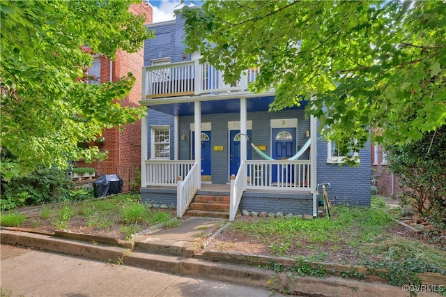 2111 Maplewood Ave, Richmond, VA 23220 - view of front of home featuring brick siding, a balcony, and covered porch