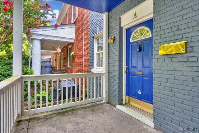 2111 Maplewood Ave, Richmond, VA 23220 - property entrance featuring brick siding and covered porch