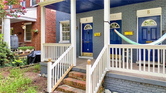 2111 Maplewood Ave, Richmond, VA 23220 - property entrance with covered porch and brick siding