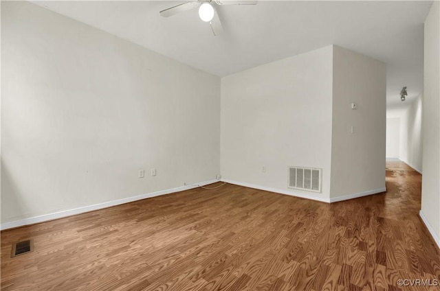 2111 Maplewood Ave, Richmond, VA 23220 - unfurnished room with baseboards, a ceiling fan, wood finished floors, and visible vents