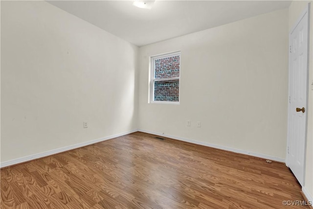 2111 Maplewood Ave, Richmond, VA 23220 - spare room with baseboards and wood finished floors