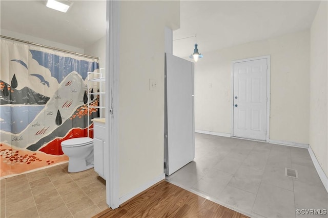 2111 Maplewood Ave, Richmond, VA 23220 - interior space with toilet, baseboards, visible vents, and tile patterned floors