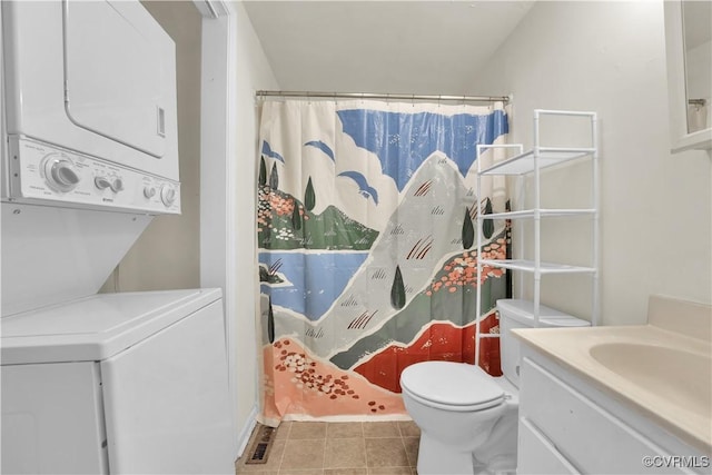2111 Maplewood Ave, Richmond, VA 23220 - full bathroom with tile patterned flooring, stacked washer and clothes dryer, vanity, toilet, and a shower with shower curtain