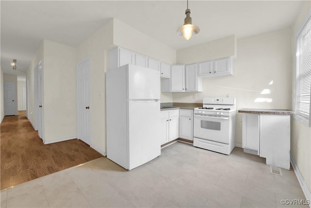 2111 Maplewood Ave, Richmond, VA 23220 - kitchen with baseboards, white cabinets, white appliances, and decorative light fixtures