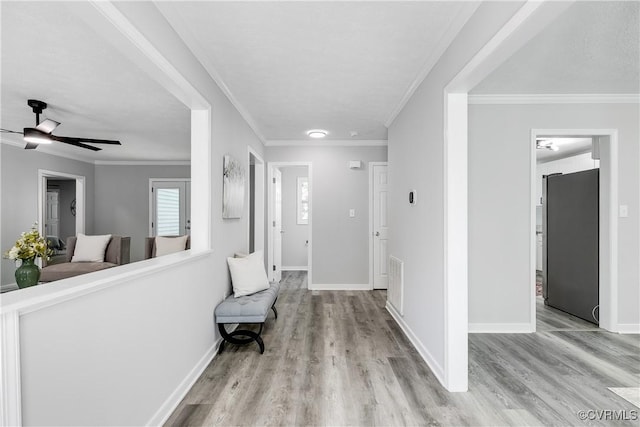 7713 Flag Tail Dr, Midlothian, VA 23112 - entryway featuring wood finished floors, baseboards, ceiling fan, and crown molding