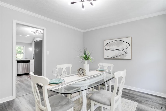 7713 Flag Tail Dr, Midlothian, VA 23112 - dining room featuring light wood finished floors, baseboards, and crown molding