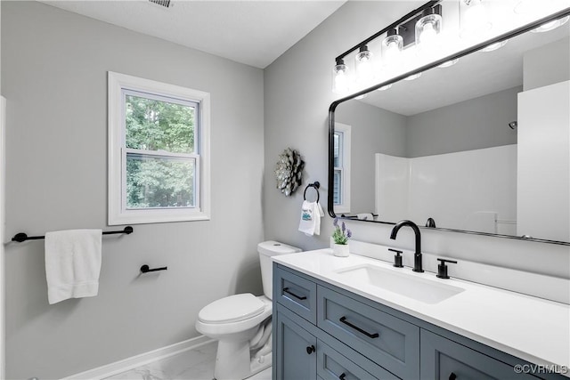 7713 Flag Tail Dr, Midlothian, VA 23112 - full bath with marble look tiles, baseboards, toilet, vanity, and a shower
