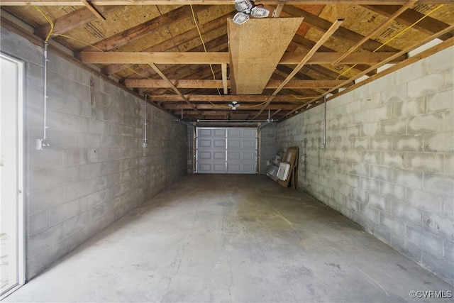 garage with concrete block wall